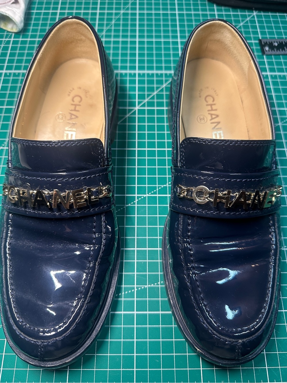 CHANEL Navy Patent Leather Chain-Logo Loafers